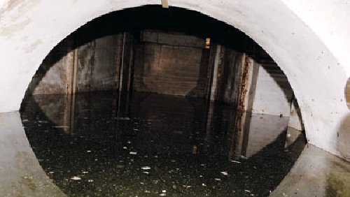 One of the exits of the tunnel which is now partially submerged underwater and muck leads to St George next to Blue Gate